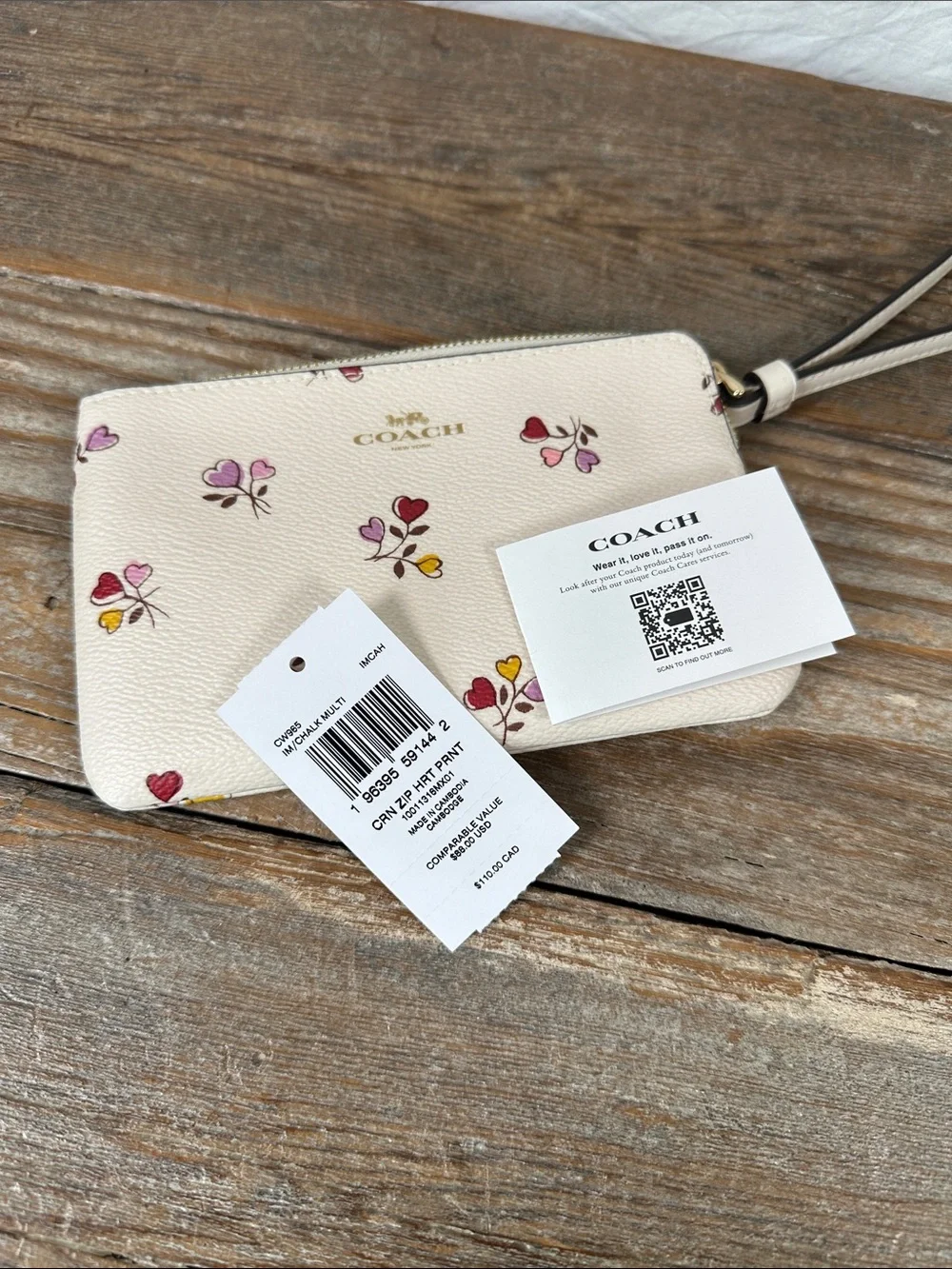 Coach Cream Wristlet with Multicolor Floral Hearts